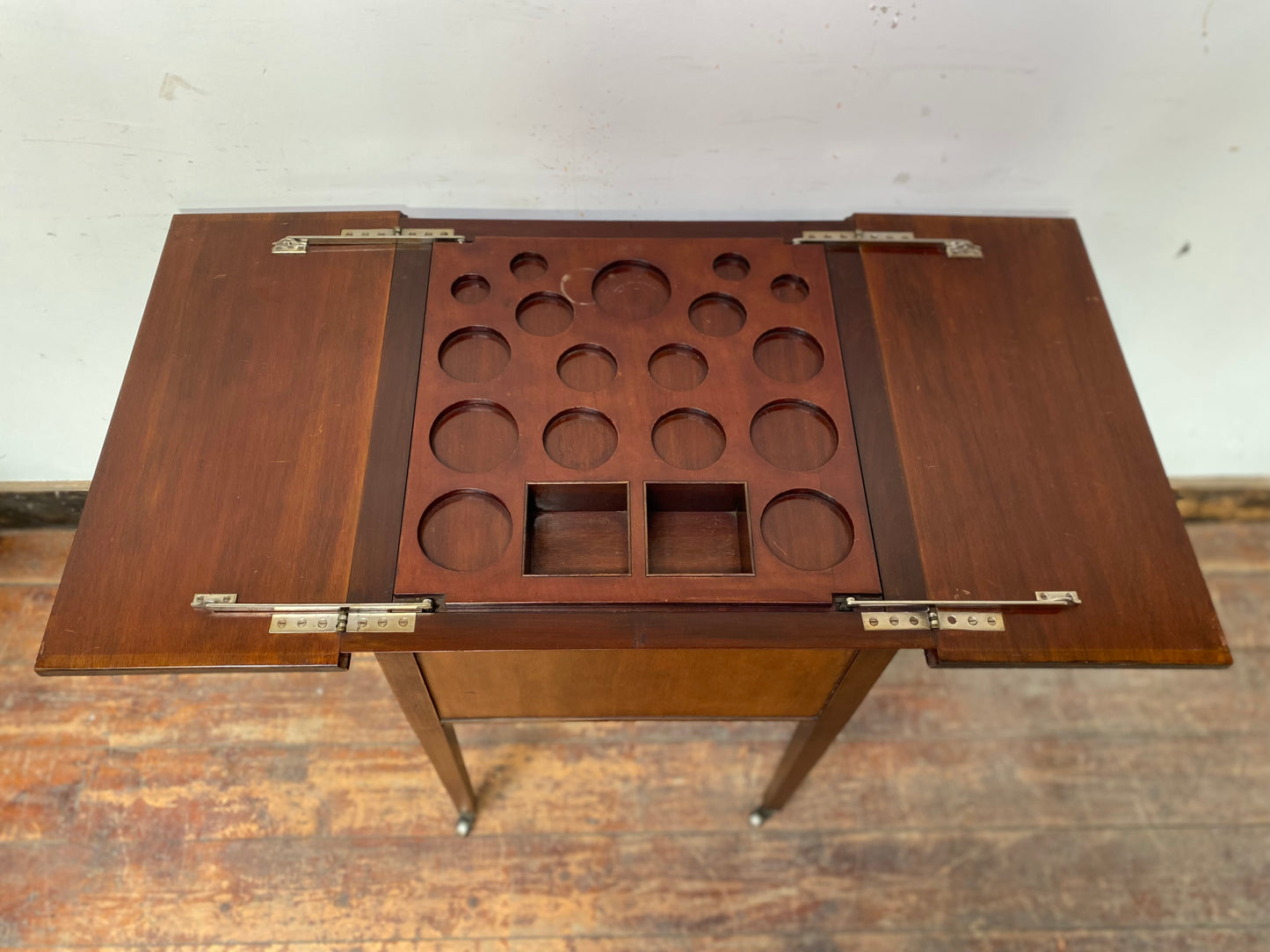 Antique 'rise and fall' hidden drinks cabinet