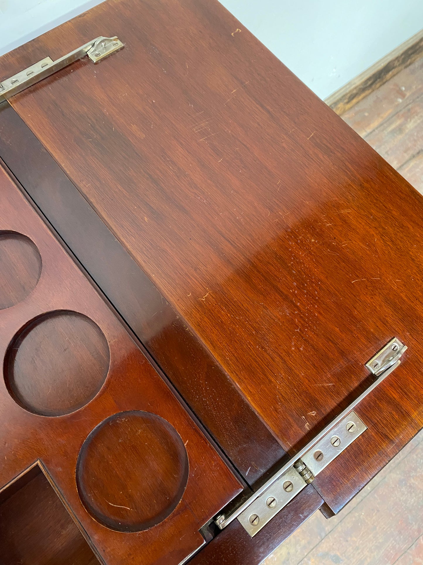Antique 'rise and fall' hidden drinks cabinet