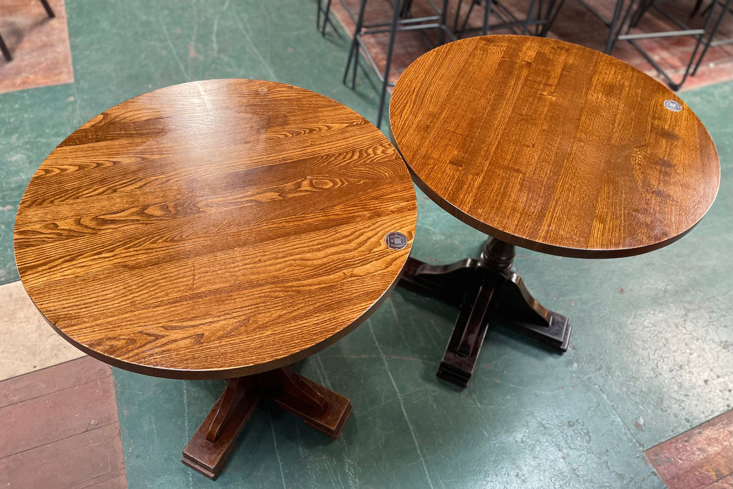 Pair of small round wooden pub tables