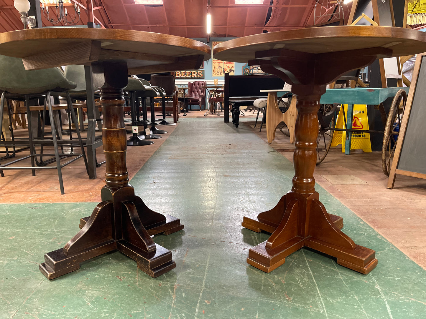Pair of small round wooden pub tables