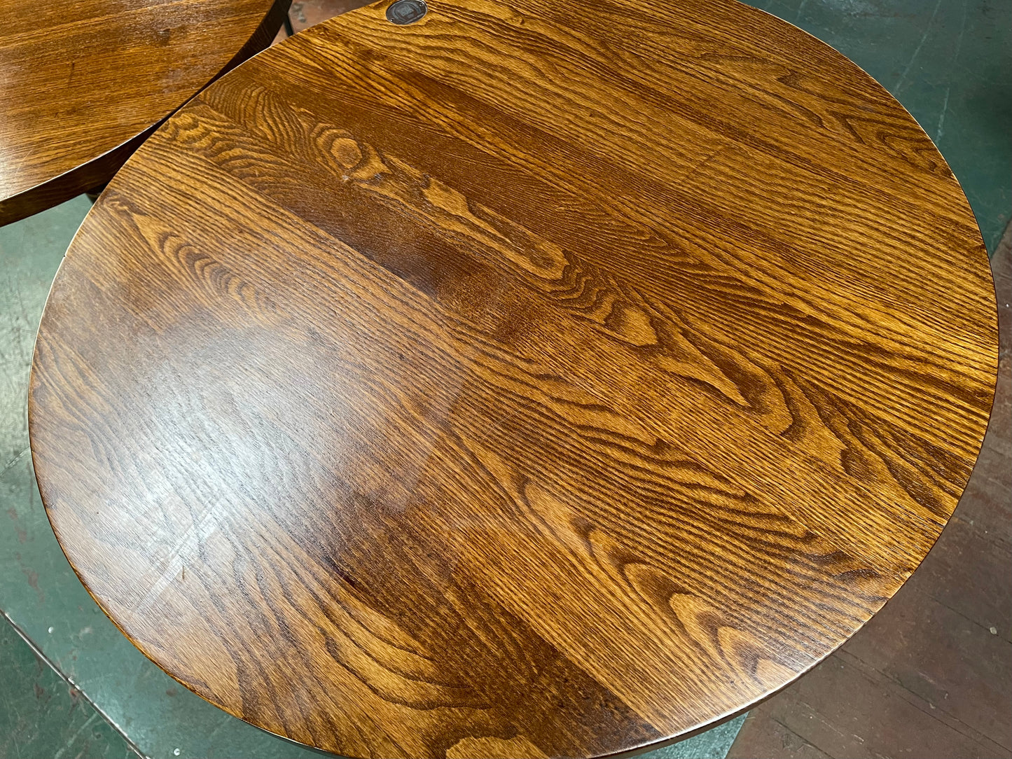 Pair of small round wooden pub tables