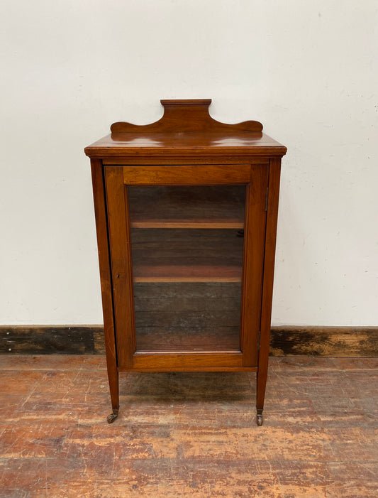 Small antique cabinet with glass door and castors