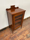 Small antique cabinet with glass door and castors