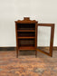 Small antique cabinet with glass door and castors