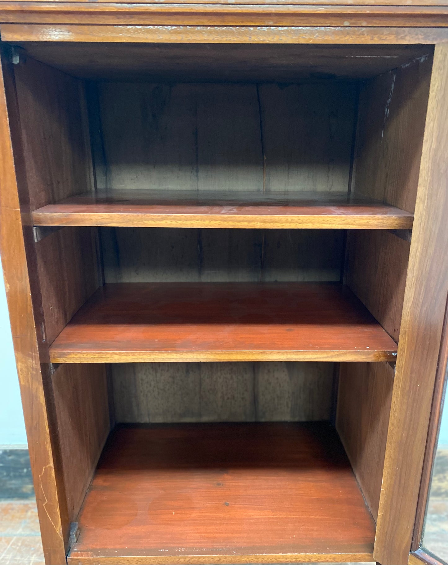 Small antique cabinet with glass door and castors