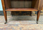 Small antique cabinet with glass door and castors