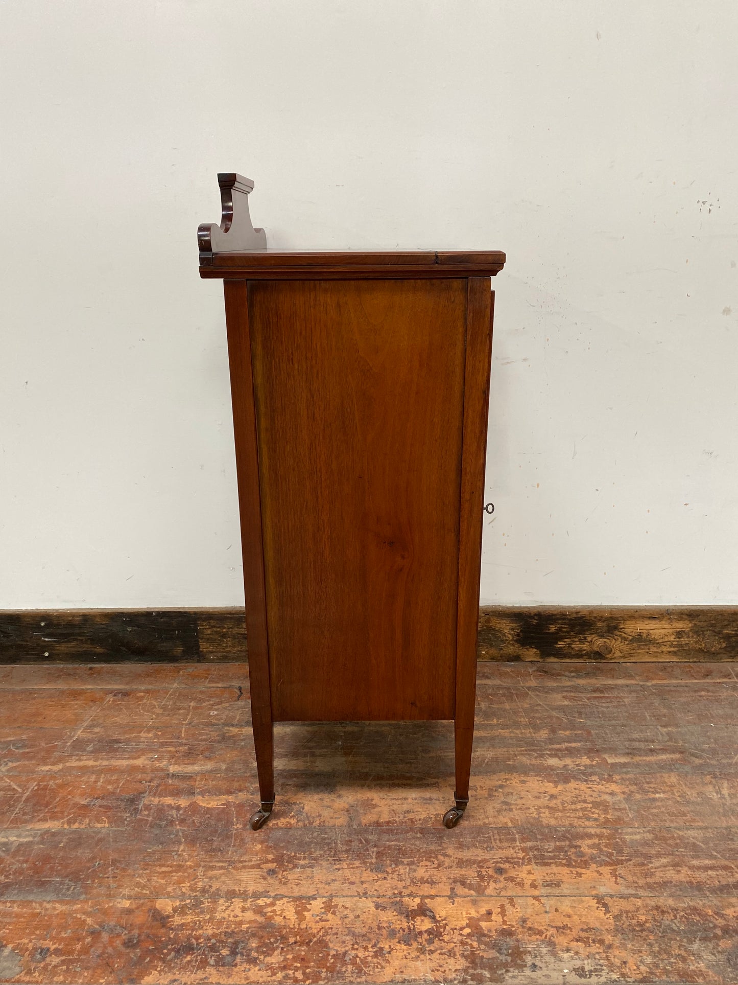 Small antique cabinet with glass door and castors