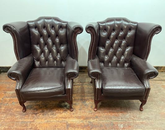 Stunning matching pair of brown leather wingback armchairs