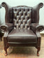 Stunning matching pair of brown leather wingback armchairs