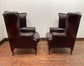 Stunning matching pair of brown leather wingback armchairs