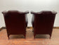 Stunning matching pair of brown leather wingback armchairs