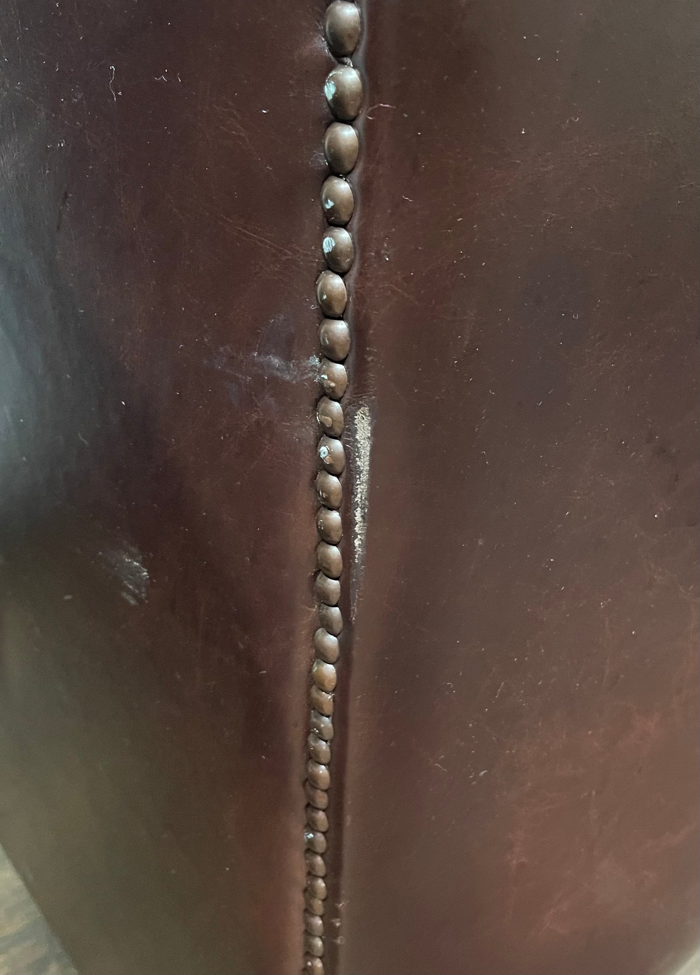 Stunning matching pair of brown leather wingback armchairs