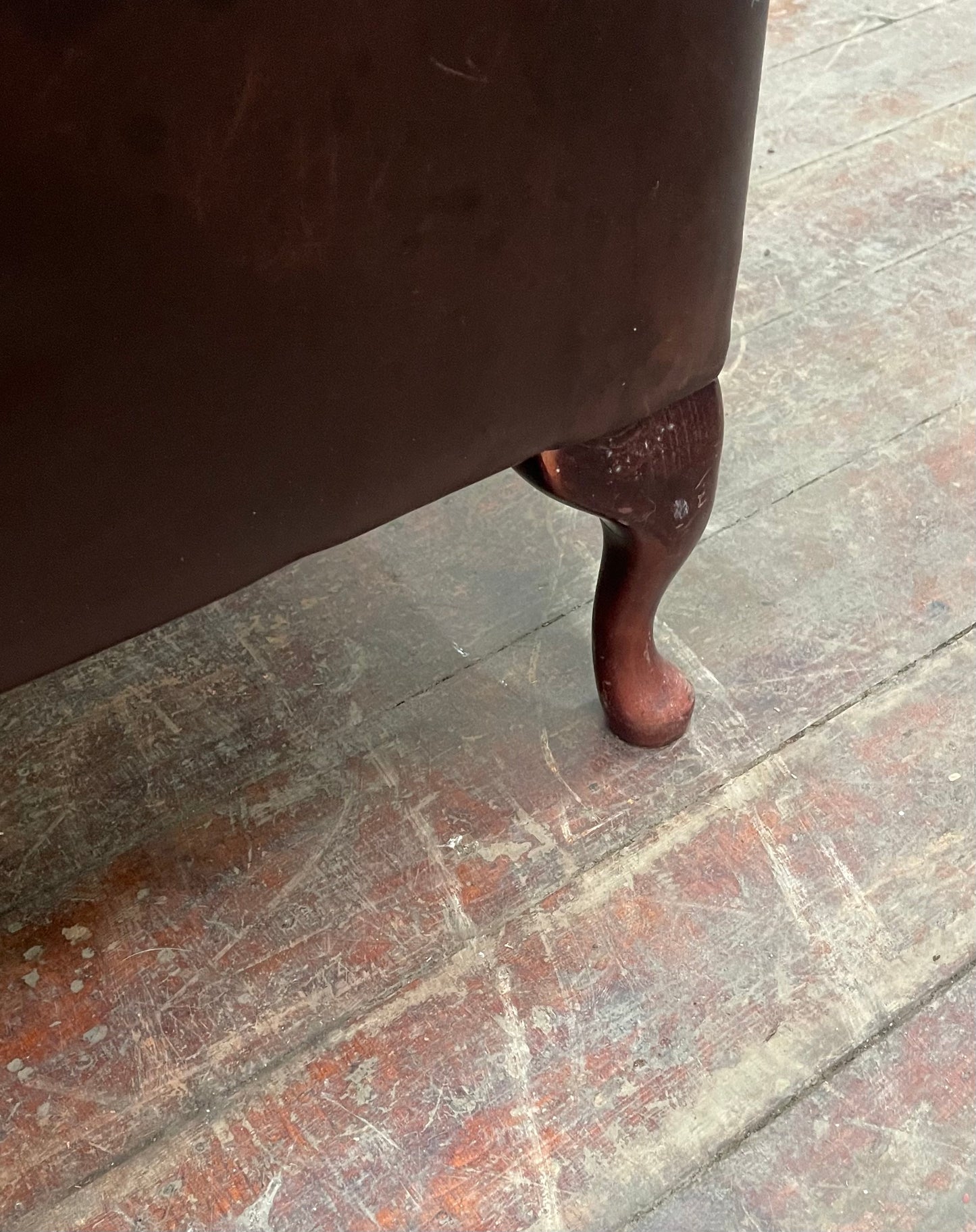 Stunning matching pair of brown leather wingback armchairs