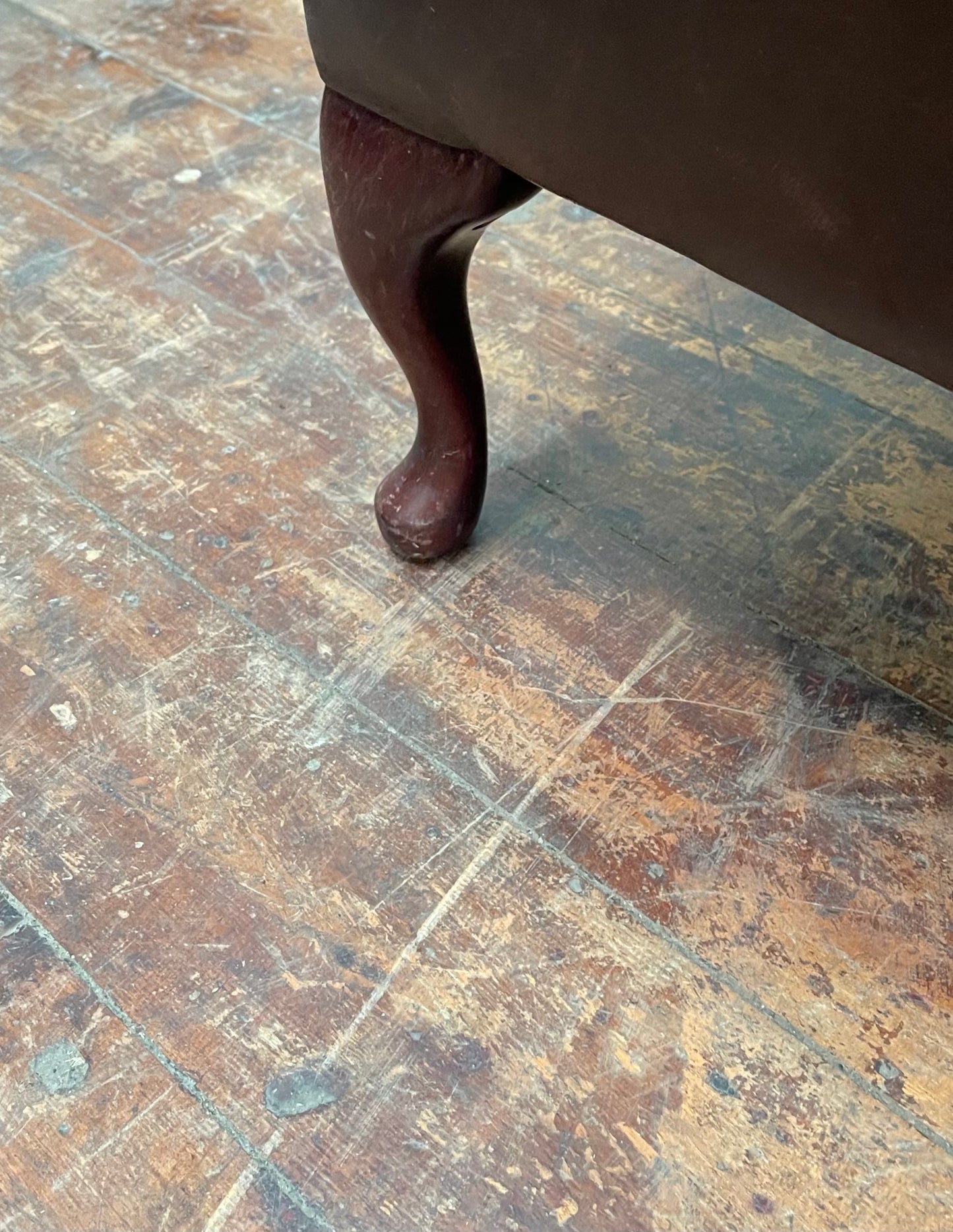 Stunning matching pair of brown leather wingback armchairs