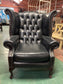 Beautiful wingback armchair in black leather