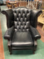 Beautiful wingback armchair in black leather