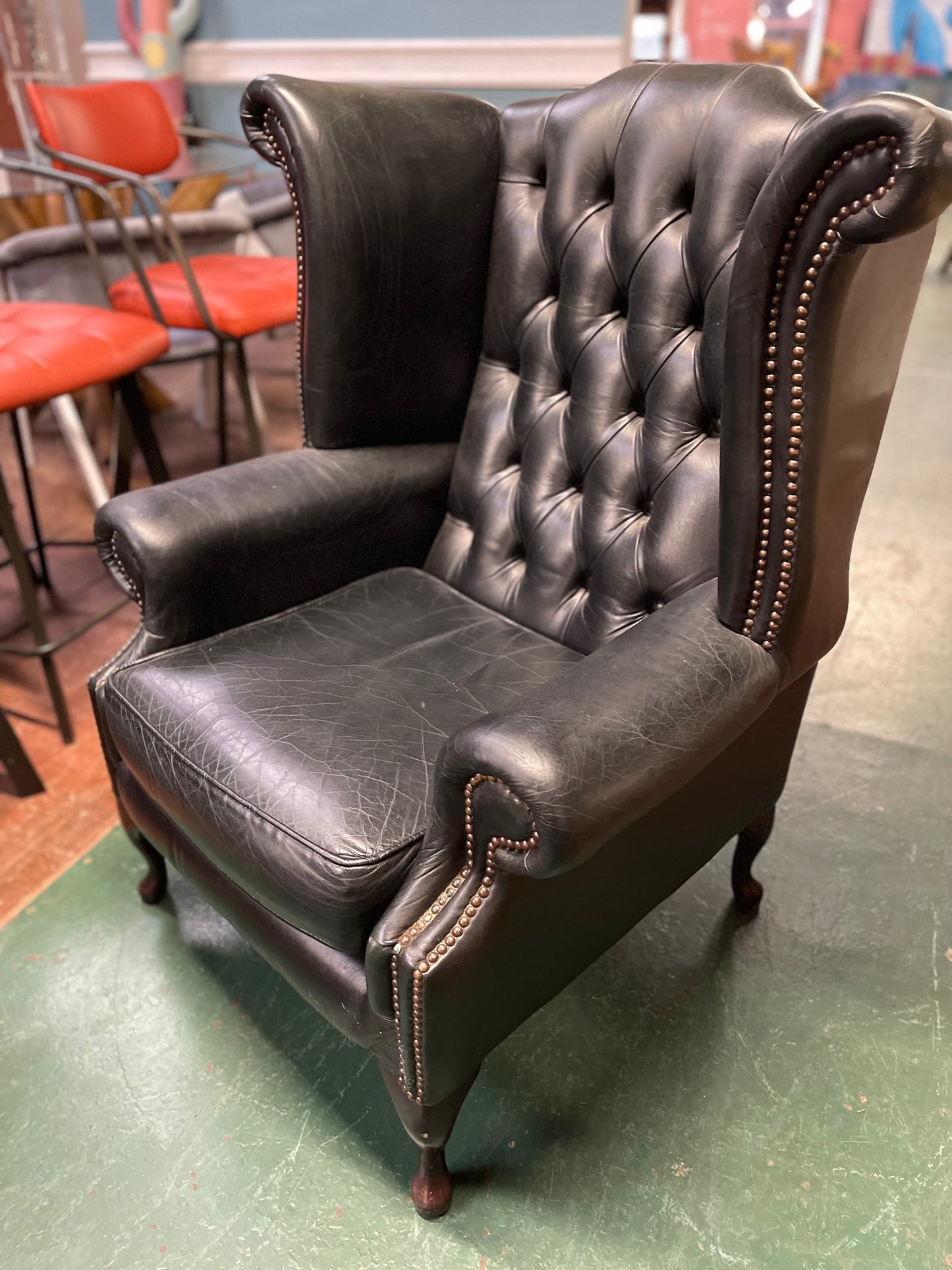 Beautiful wingback armchair in black leather