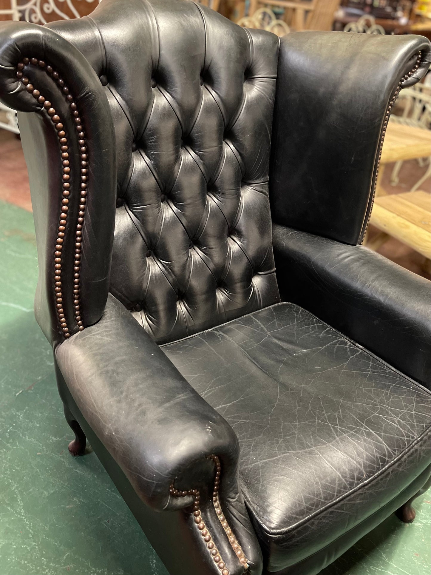 Beautiful wingback armchair in black leather