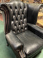 Beautiful wingback armchair in black leather