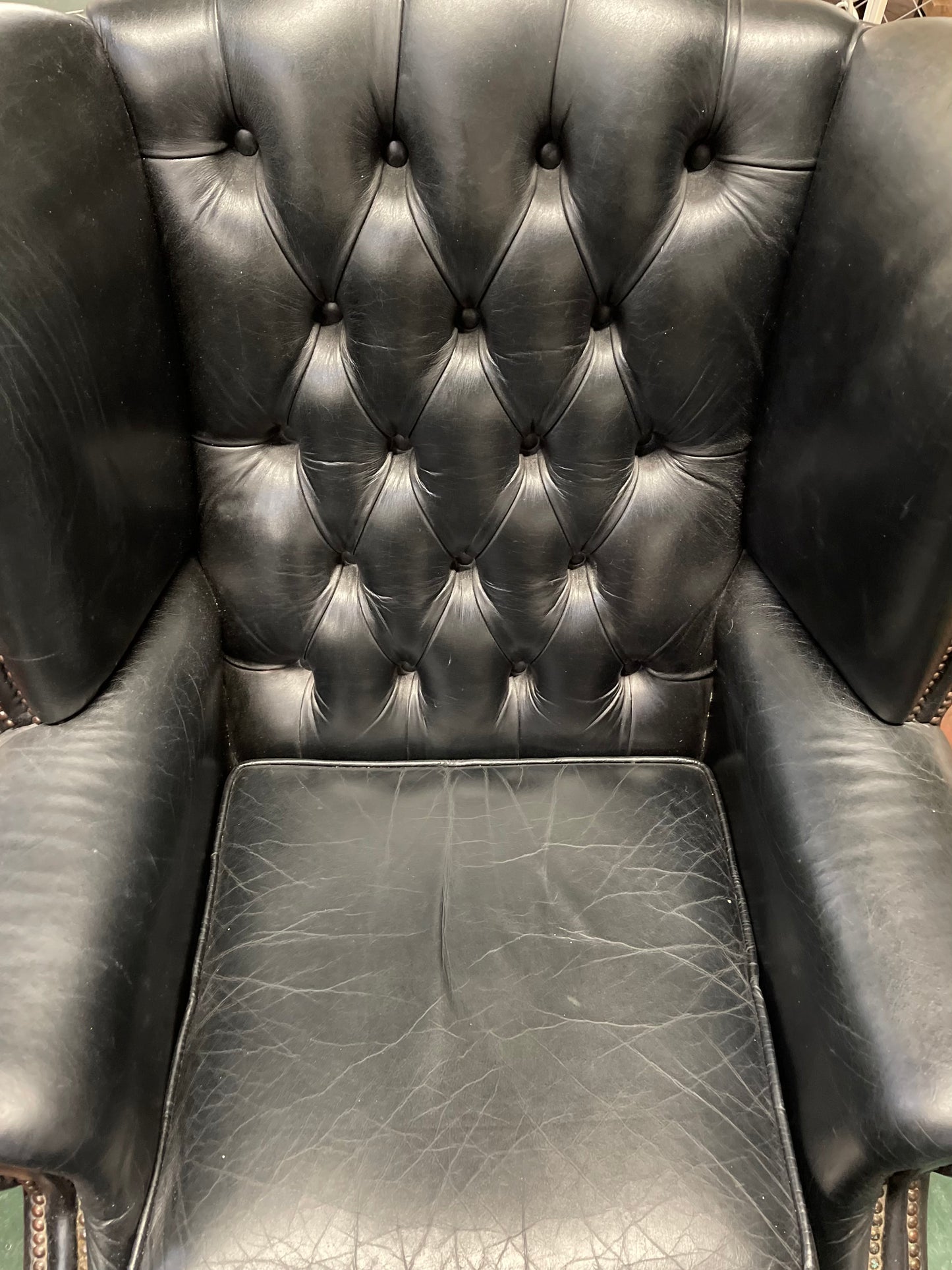 Beautiful wingback armchair in black leather