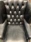 Beautiful wingback armchair in black leather
