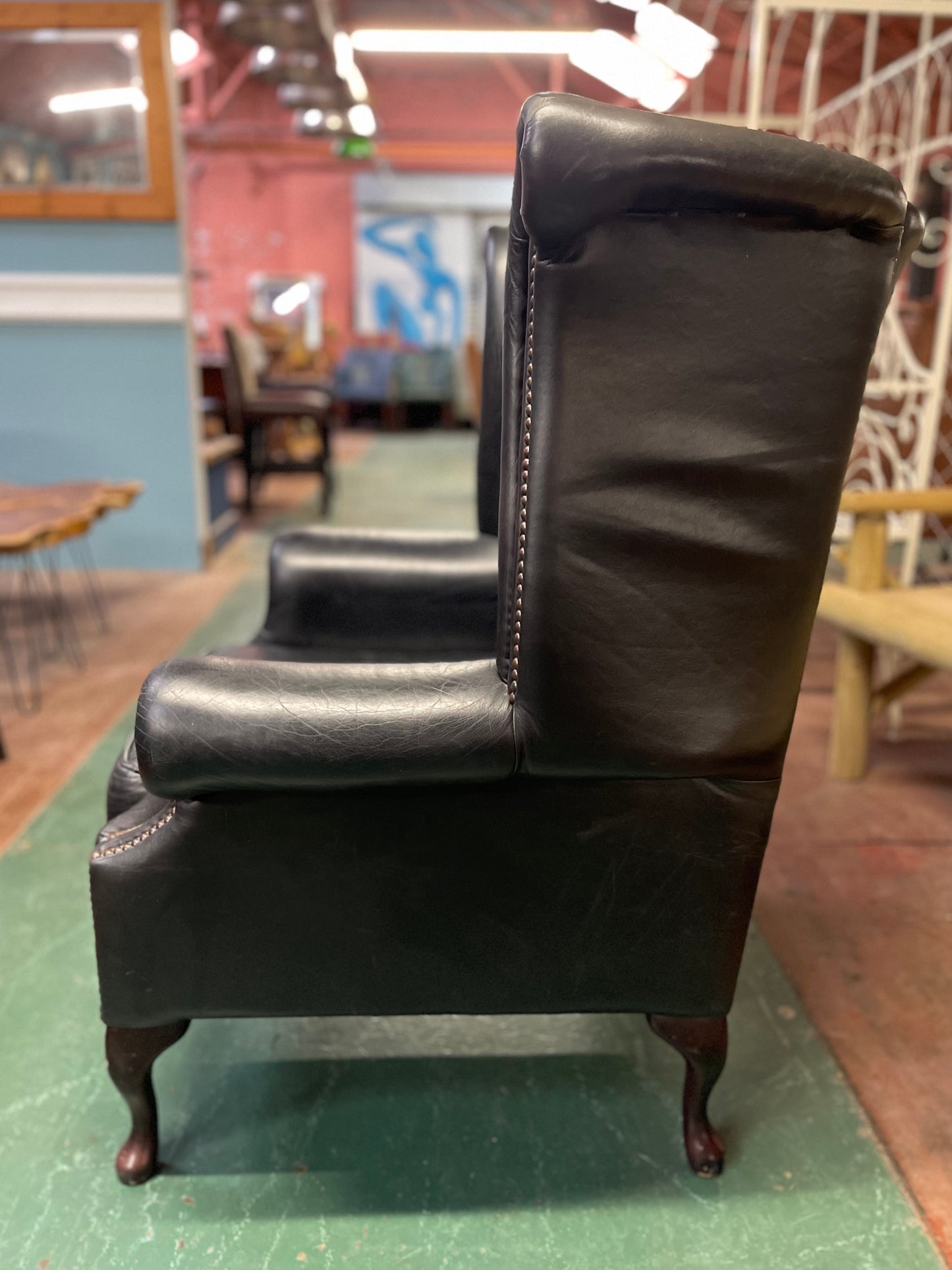 Beautiful wingback armchair in black leather