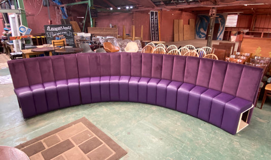 Fixed purple bench / booth seating with channel back