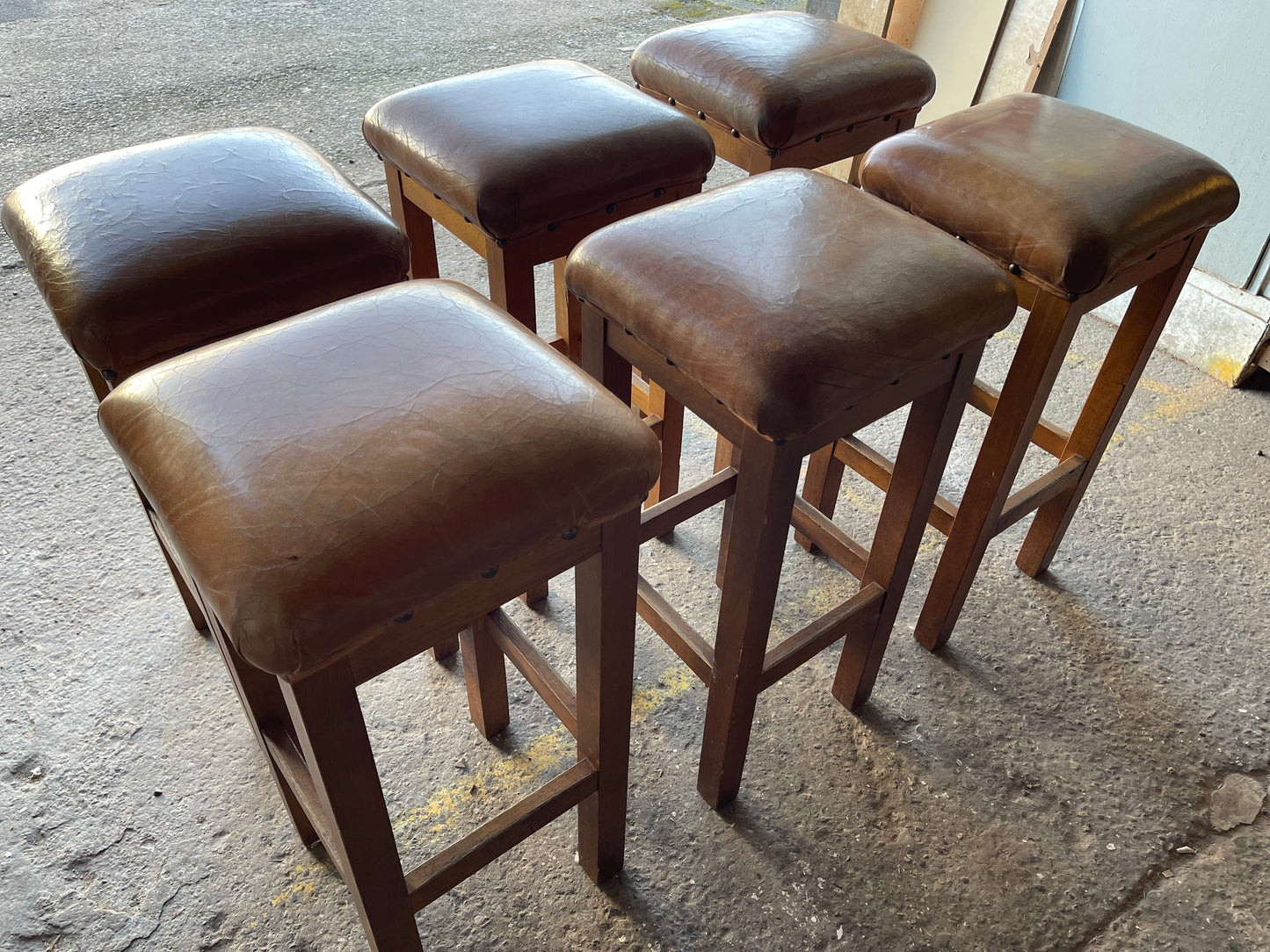 Matching set of 6 tan leather bar stools with square tops
