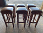 Matching set of 6 tan leather bar stools with square tops