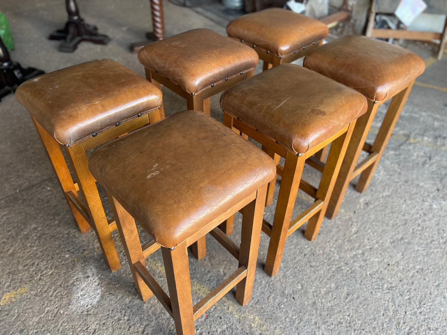 Matching set of 6 tan leather bar stools with square tops