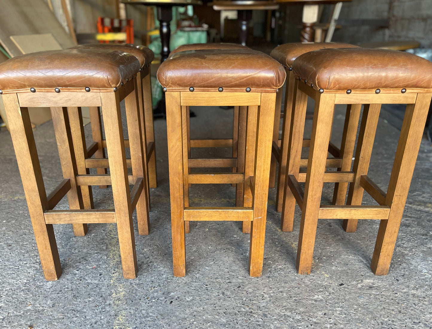 Matching set of 6 tan leather bar stools with square tops