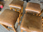 Matching set of 6 tan leather bar stools with square tops