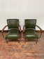 Pair of green leather armchairs with metal frame
