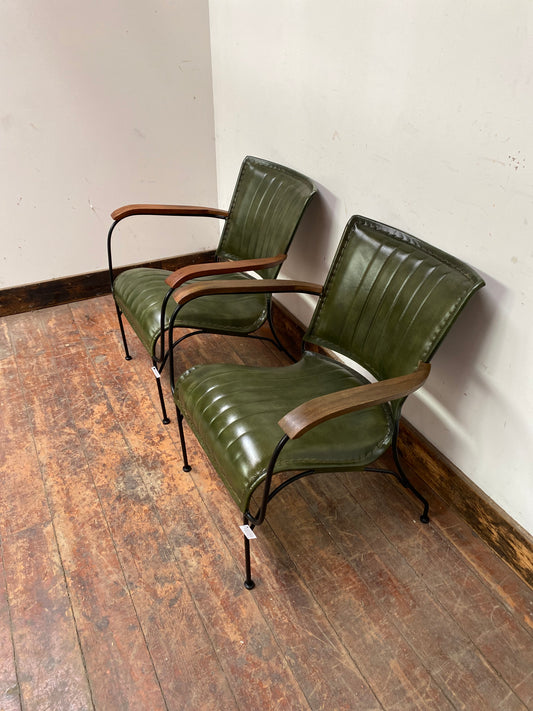 Pair of green leather armchairs with metal frame