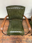 Pair of green leather armchairs with metal frame