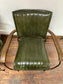 Pair of green leather armchairs with metal frame