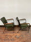 Pair of green leather armchairs with metal frame
