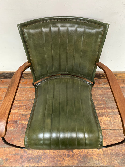 Reclined green leather armchair