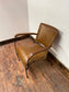 Reclined tan / brown leather armchair