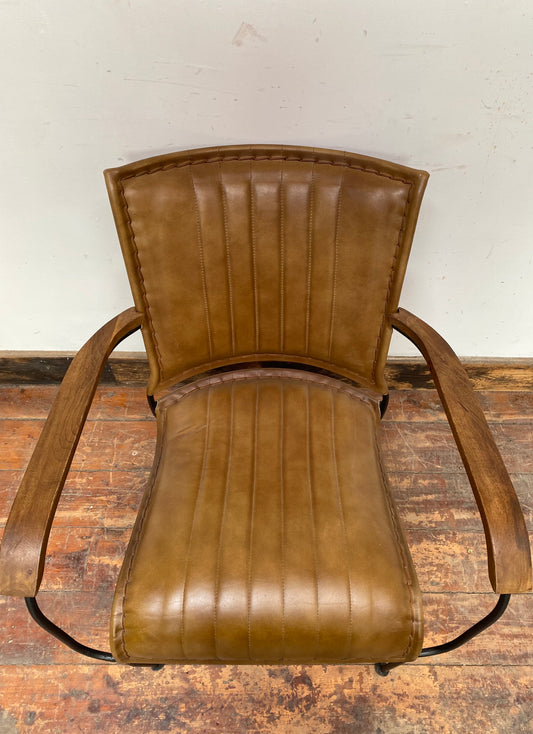 Reclined tan / brown leather armchair