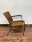 Reclined tan / brown leather armchair