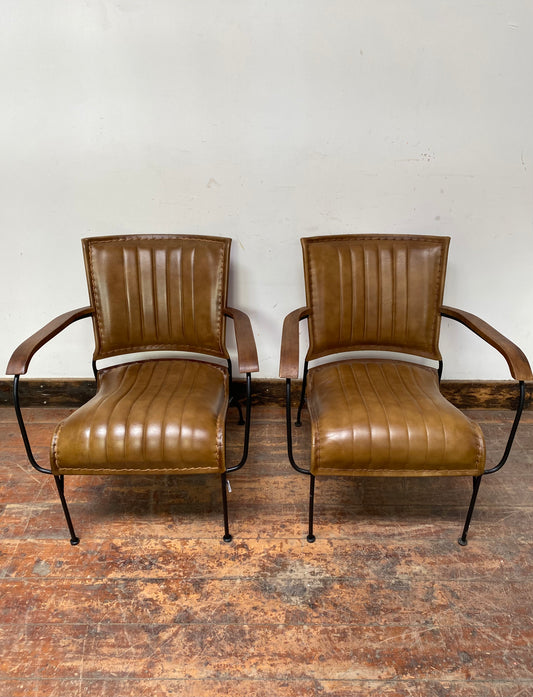 Pair of tan / brown leather armchairs with metal frame