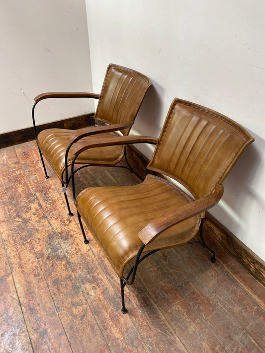 Pair of tan / brown leather armchairs with metal frame