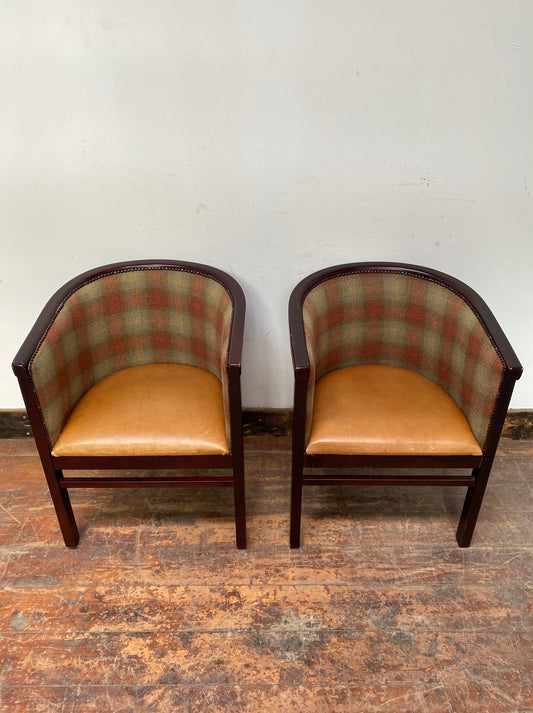 Pair of tan leather and check fabric tub chairs
