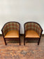 Pair of tan leather and check fabric tub chairs