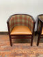 Pair of tan leather and check fabric tub chairs