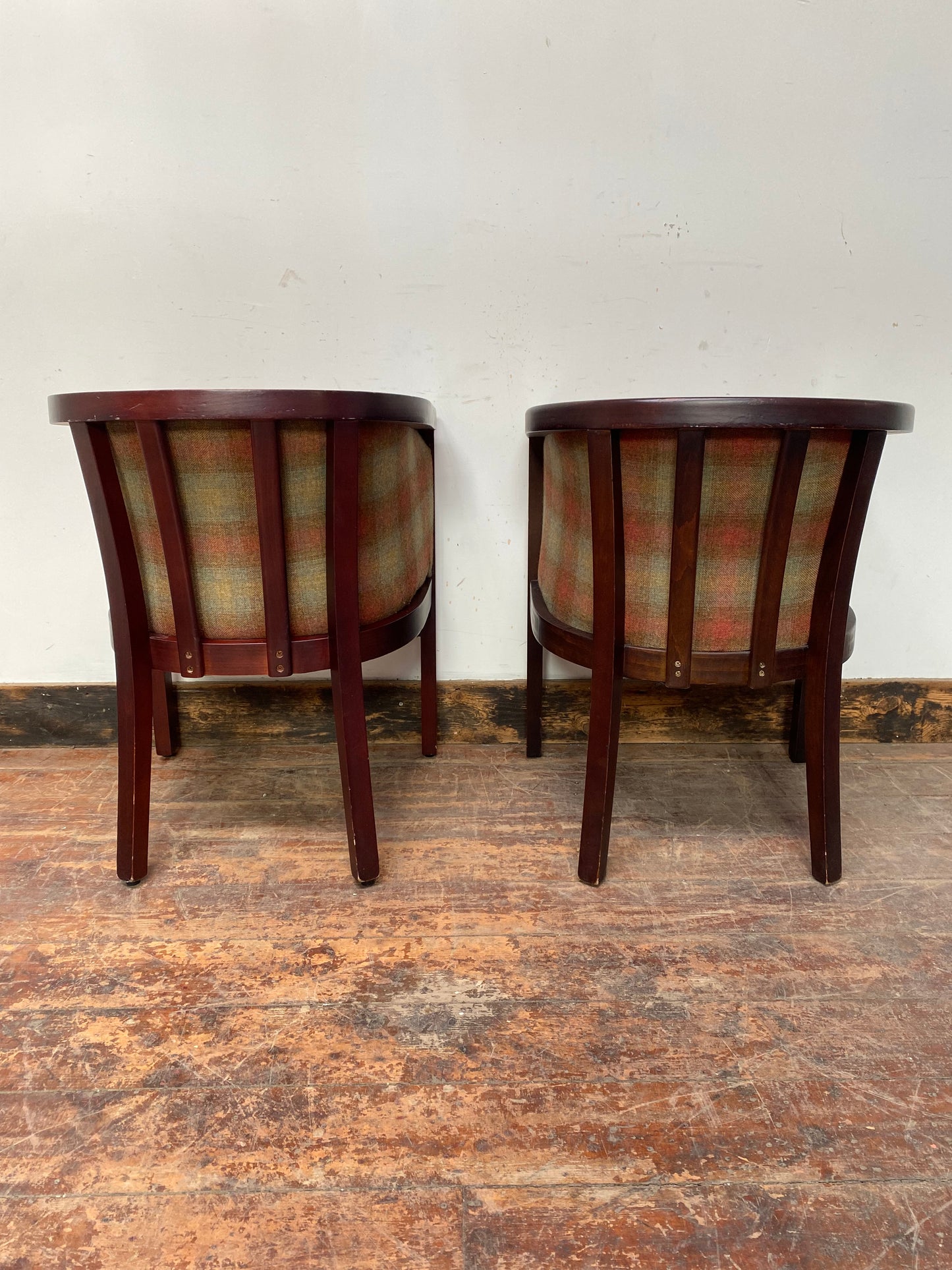 Pair of tan leather and check fabric tub chairs