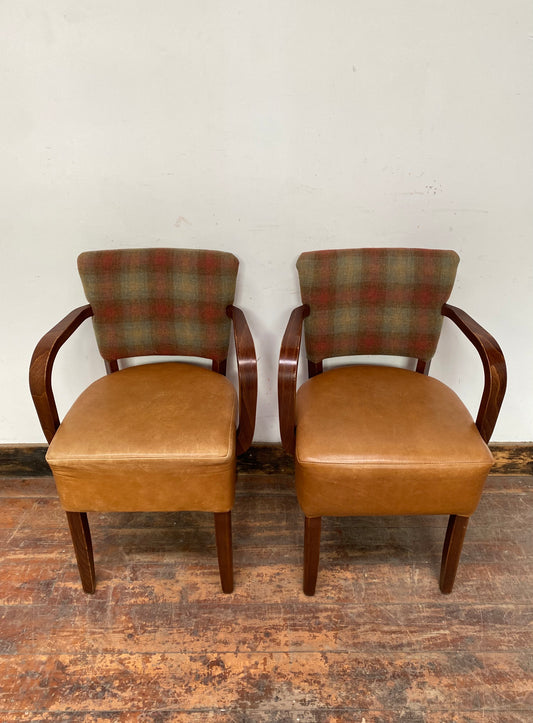 Pair of tan leather and check fabric chairs