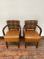 Pair of tan leather and check fabric chairs