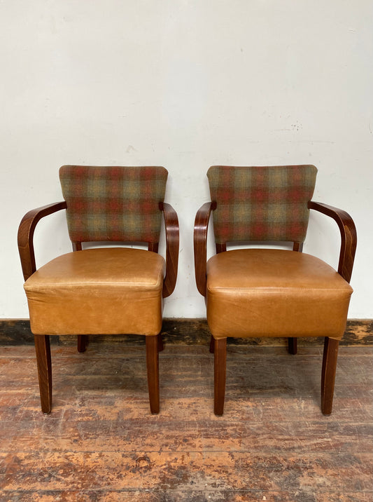 Pair of tan leather and check fabric chairs
